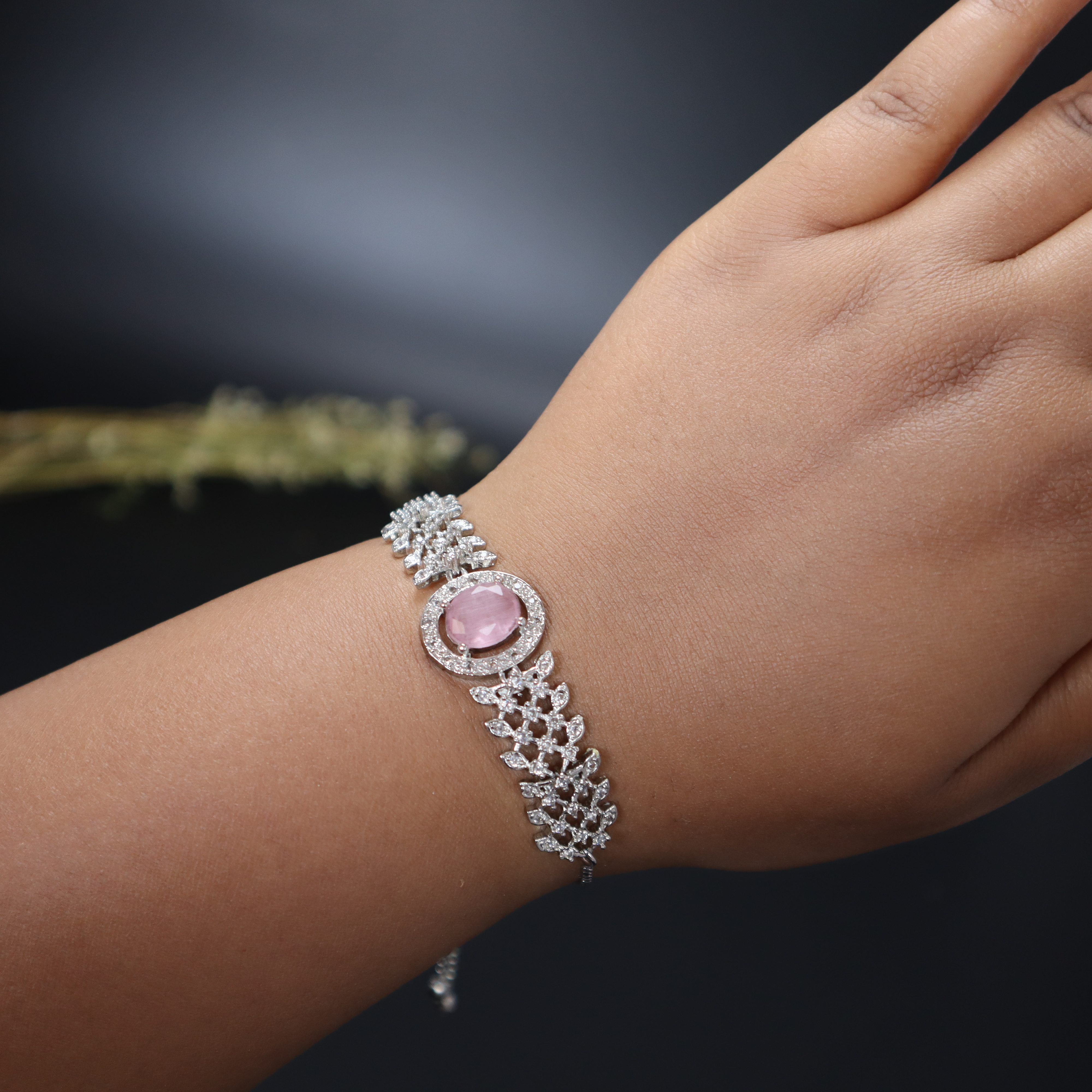 Keerthii Kalaa Pastel Pink Center Stone AD Bracelet for Women & Girls - Sparkling Silver Adjustable Chain