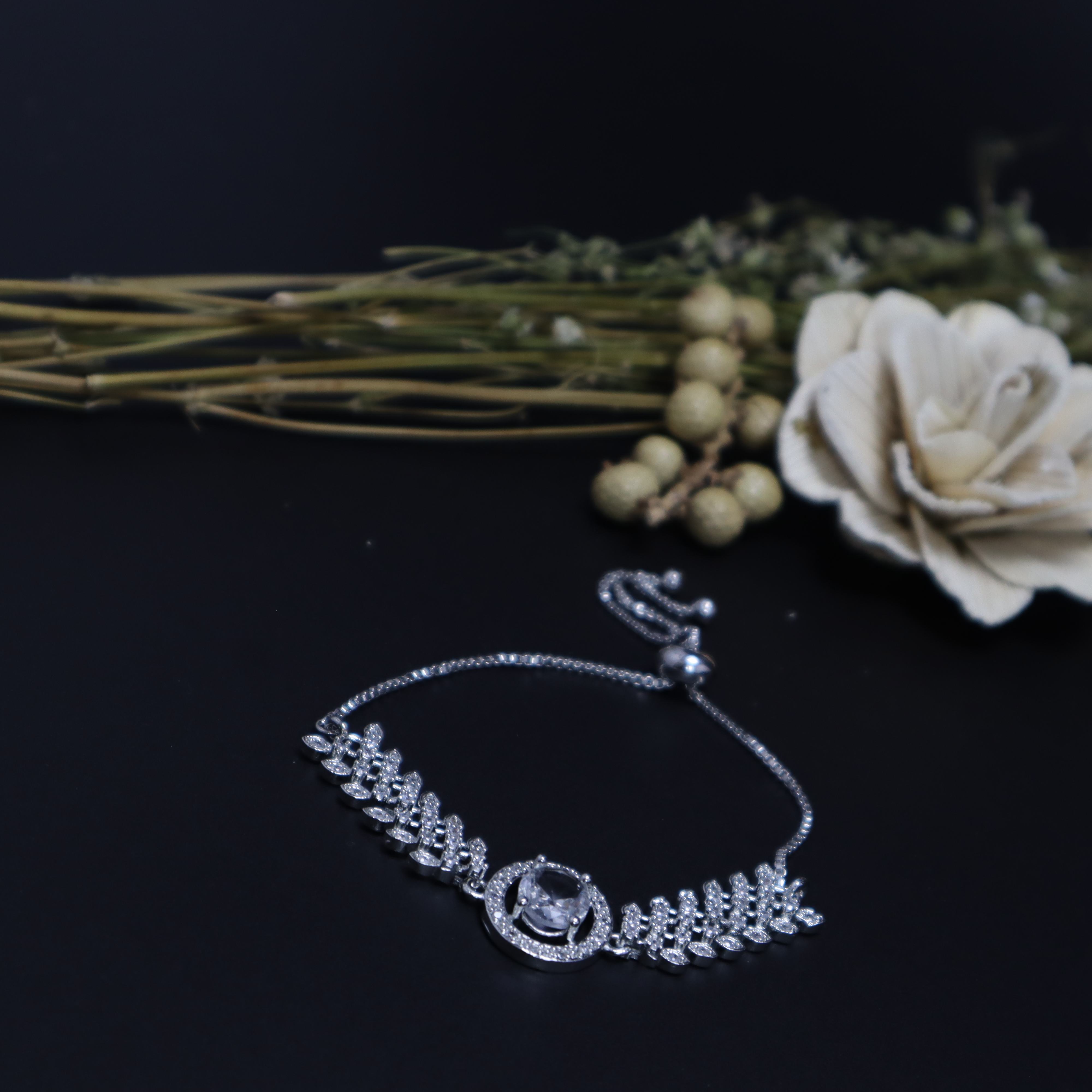 Keerthii Kalaa Oval Center Stone AD Bracelet for Women & Girls - Sparkling Silver Adjustable Chain