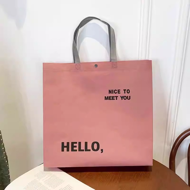  COMBO 50 Túi xách không dệt màu hồng "Hello" – Đáng yêu, tiện lợi & đậm chất thời trang!