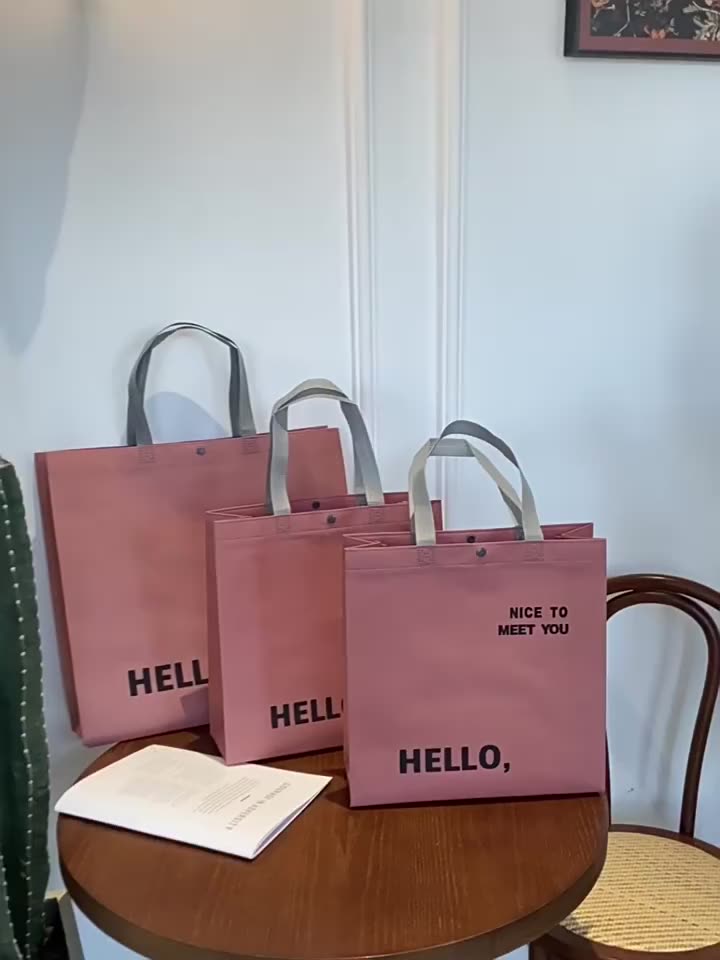  COMBO 50 Túi xách không dệt màu hồng "Hello" – Đáng yêu, tiện lợi & đậm chất thời trang!