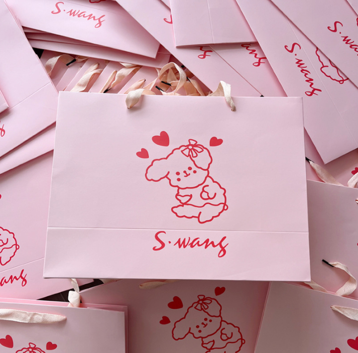 combo 50 Túi giấy Spot túi xách màu hồng cửa hàng quần áo trẻ em túi xách in bìa cứng màu trắng túi mua sắm túi quà tặng