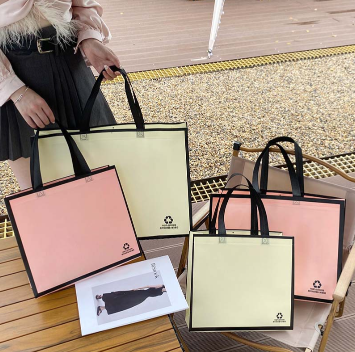 Túi xách vải không dệt thân thiện với môi trường có thể in LOGO quần áo cửa hàng quần áo túi đóng gói quà tặng quần áo phụ nữ 