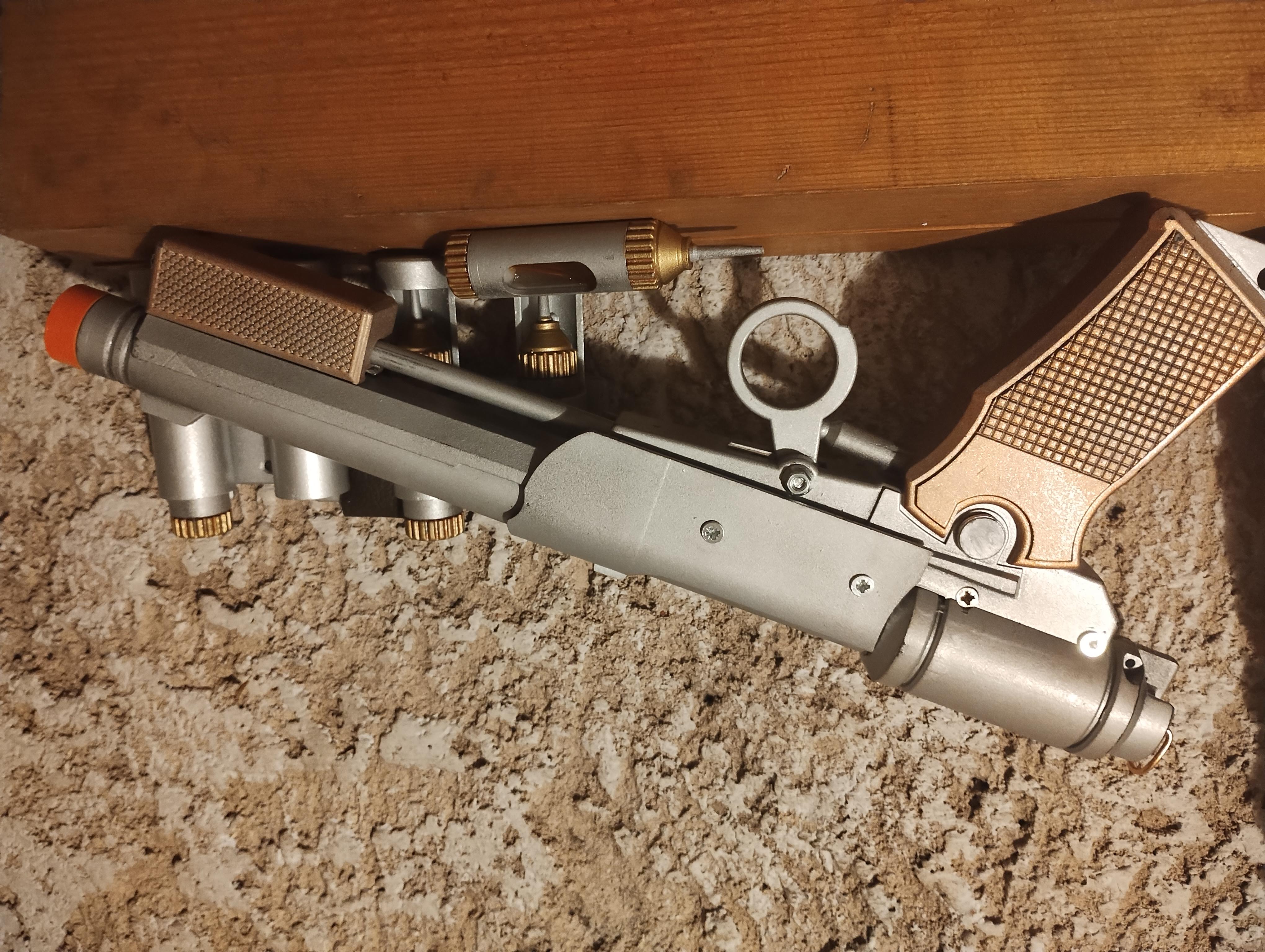 Lucy's  needler pistol.