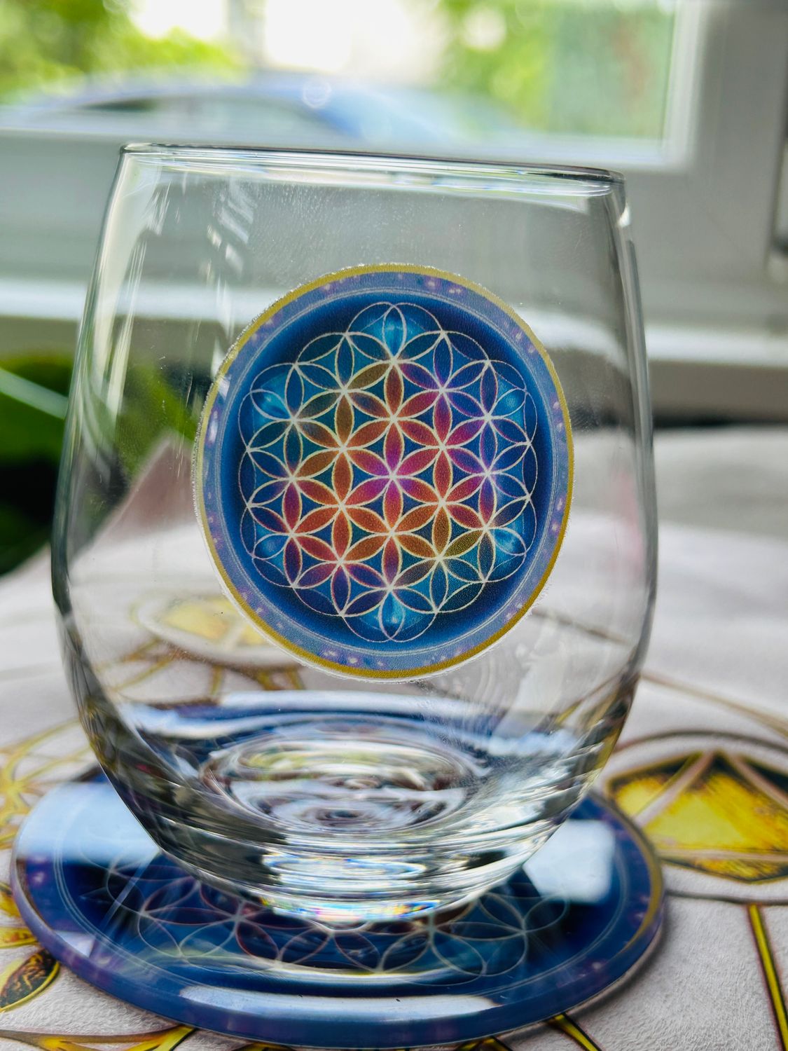 Verre fleur de vie couleur et dessous de verre assorti