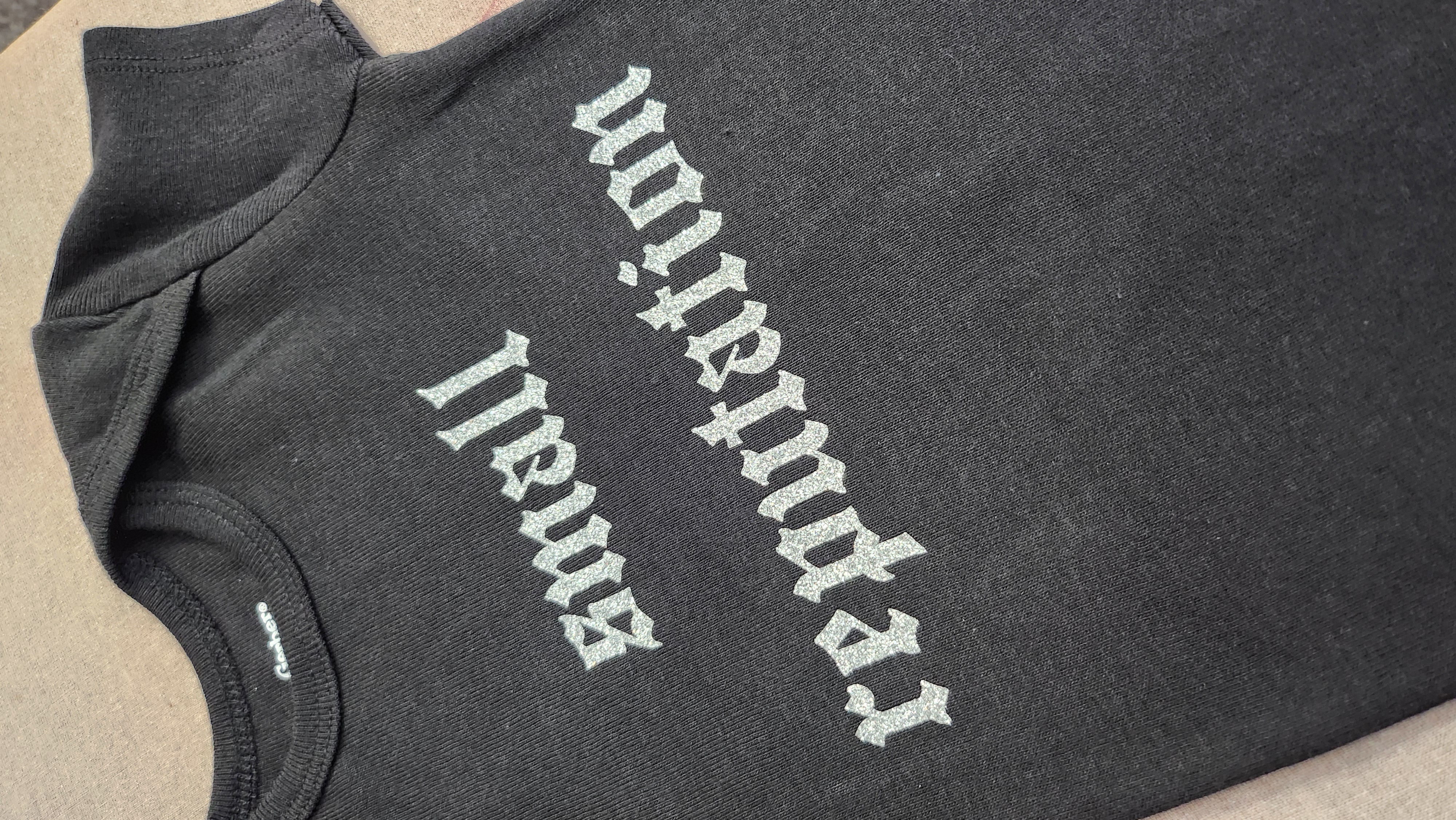 Small Reputation Glitter on Black Baby Onesie
