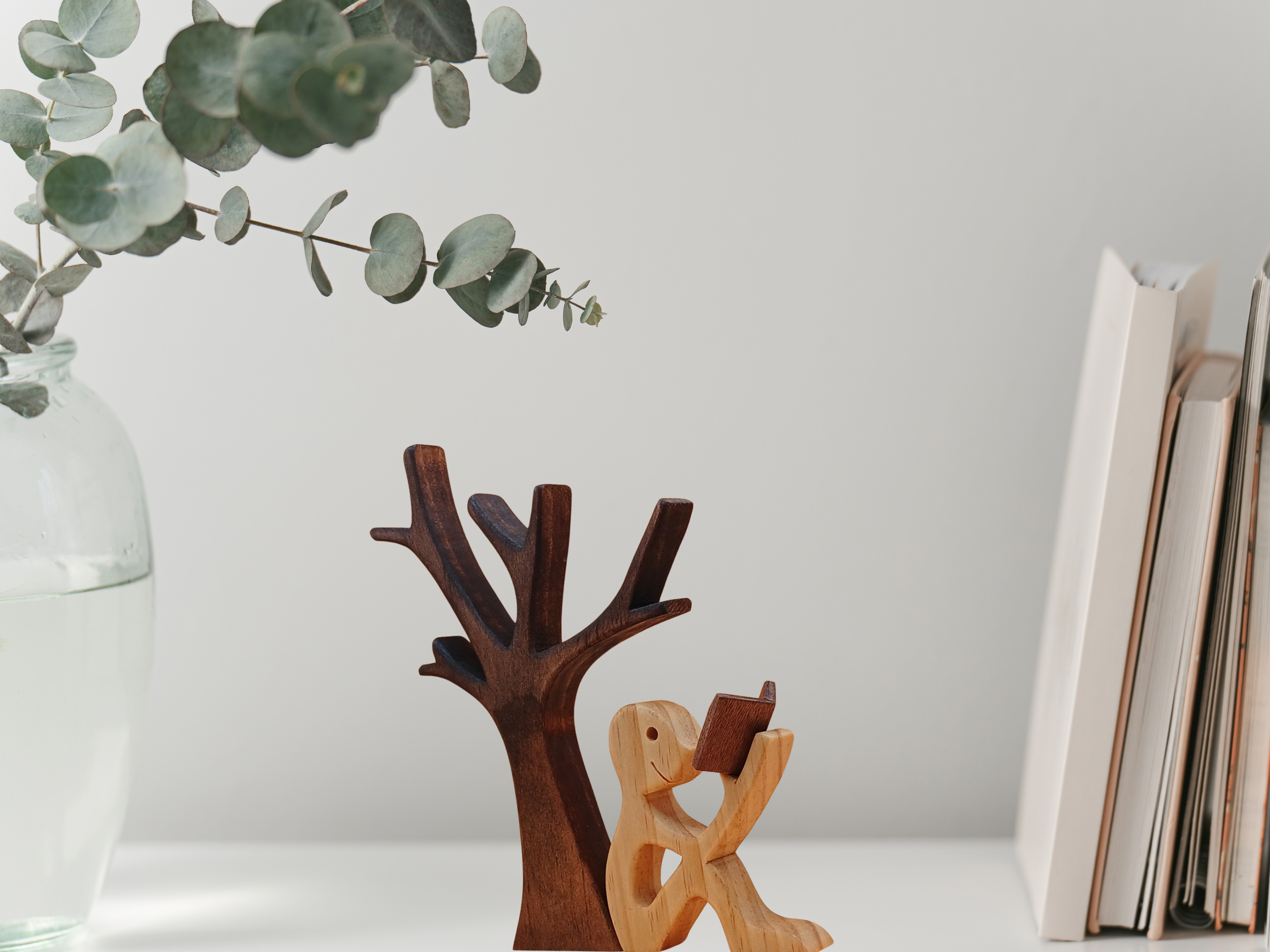Handcrafted Figurine of a Man Sitting Under a Tree Reading a Book