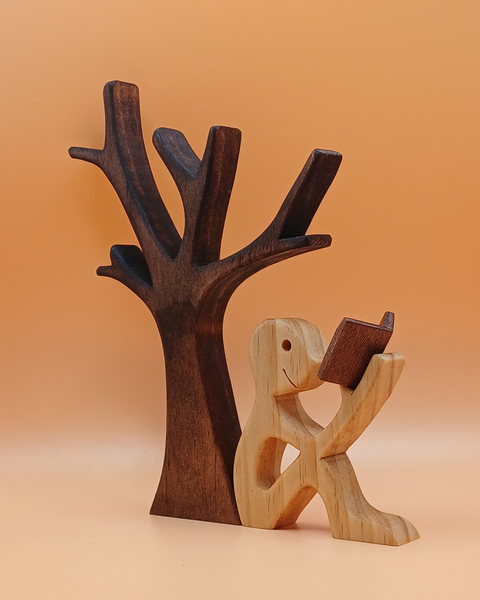 Handcrafted Figurine of a Man Sitting Under a Tree Reading a Book