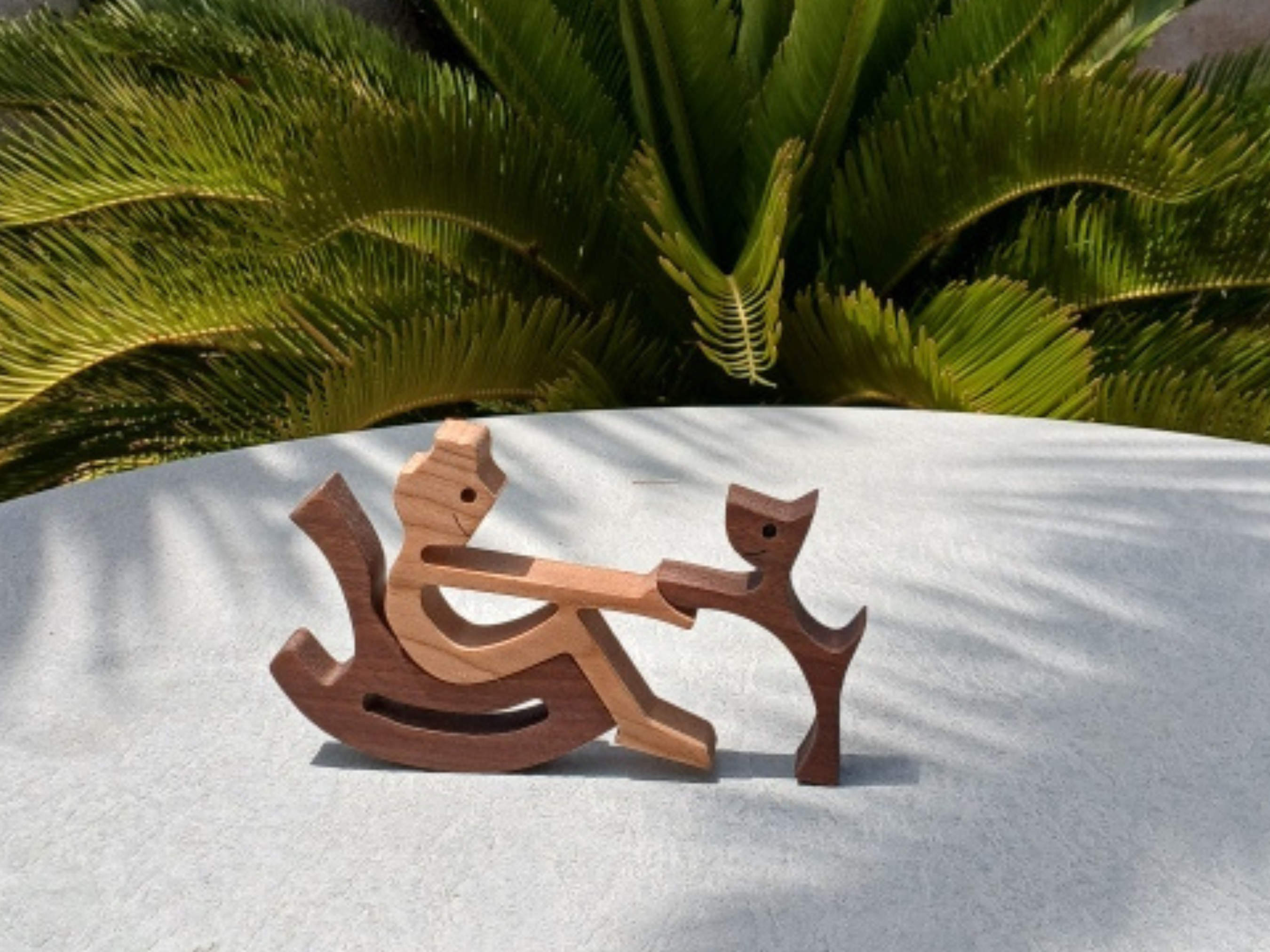 Wooden Boy in Rocking Chair with Beloved Pet