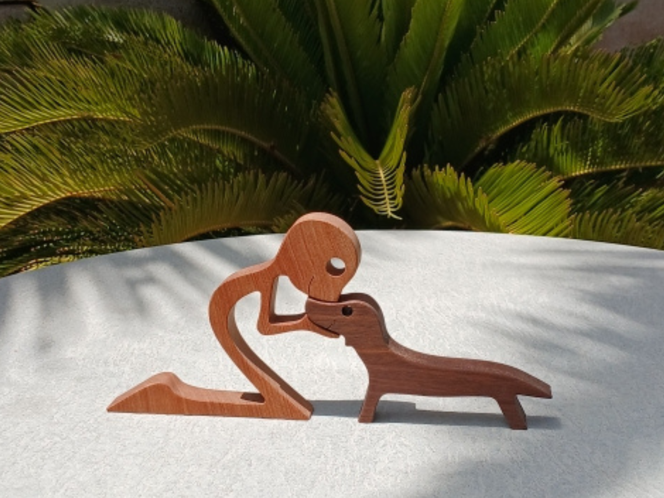 Wooden Man with Dachshund Figurine