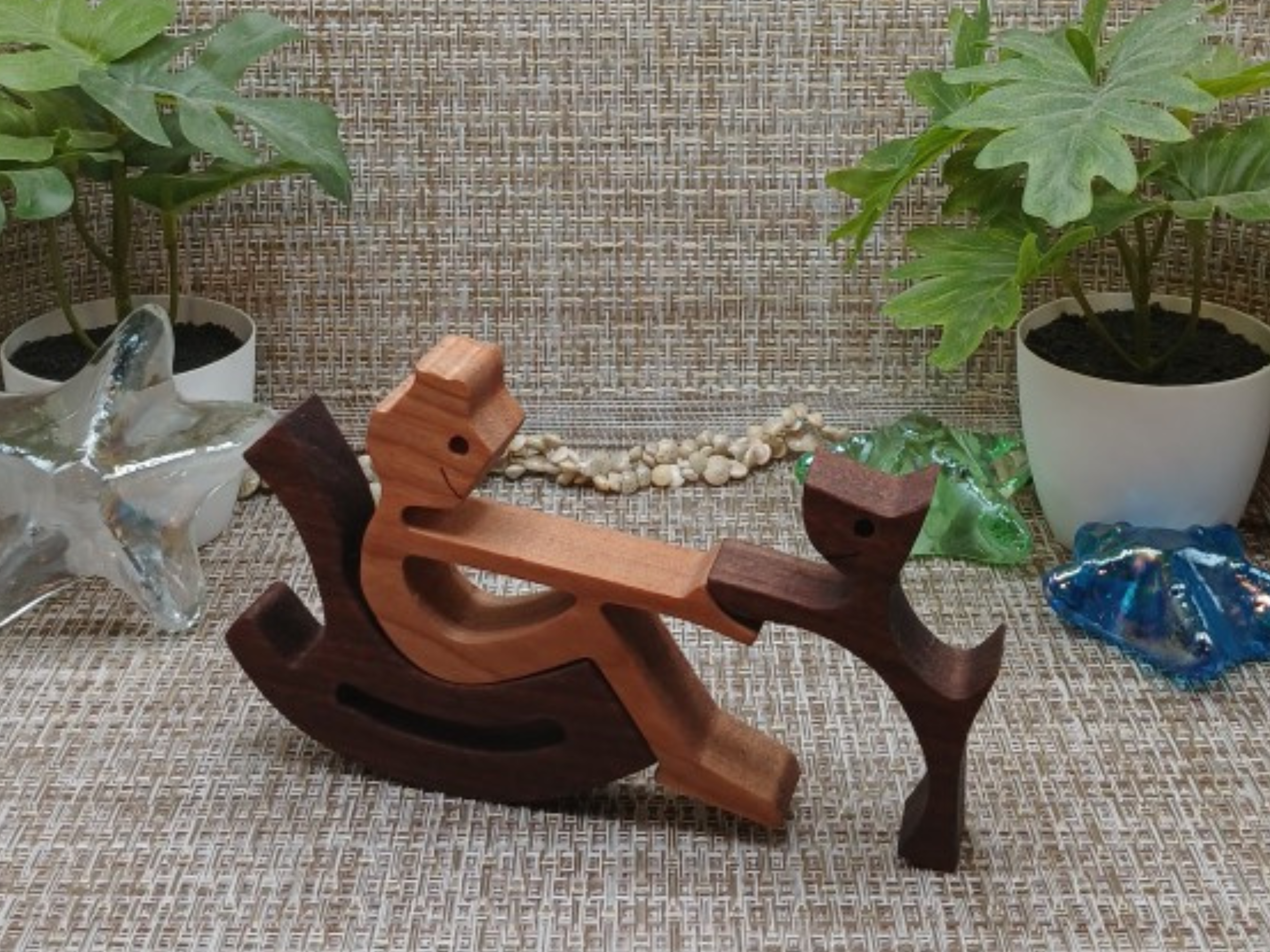 Wooden Boy in Rocking Chair with Beloved Pet