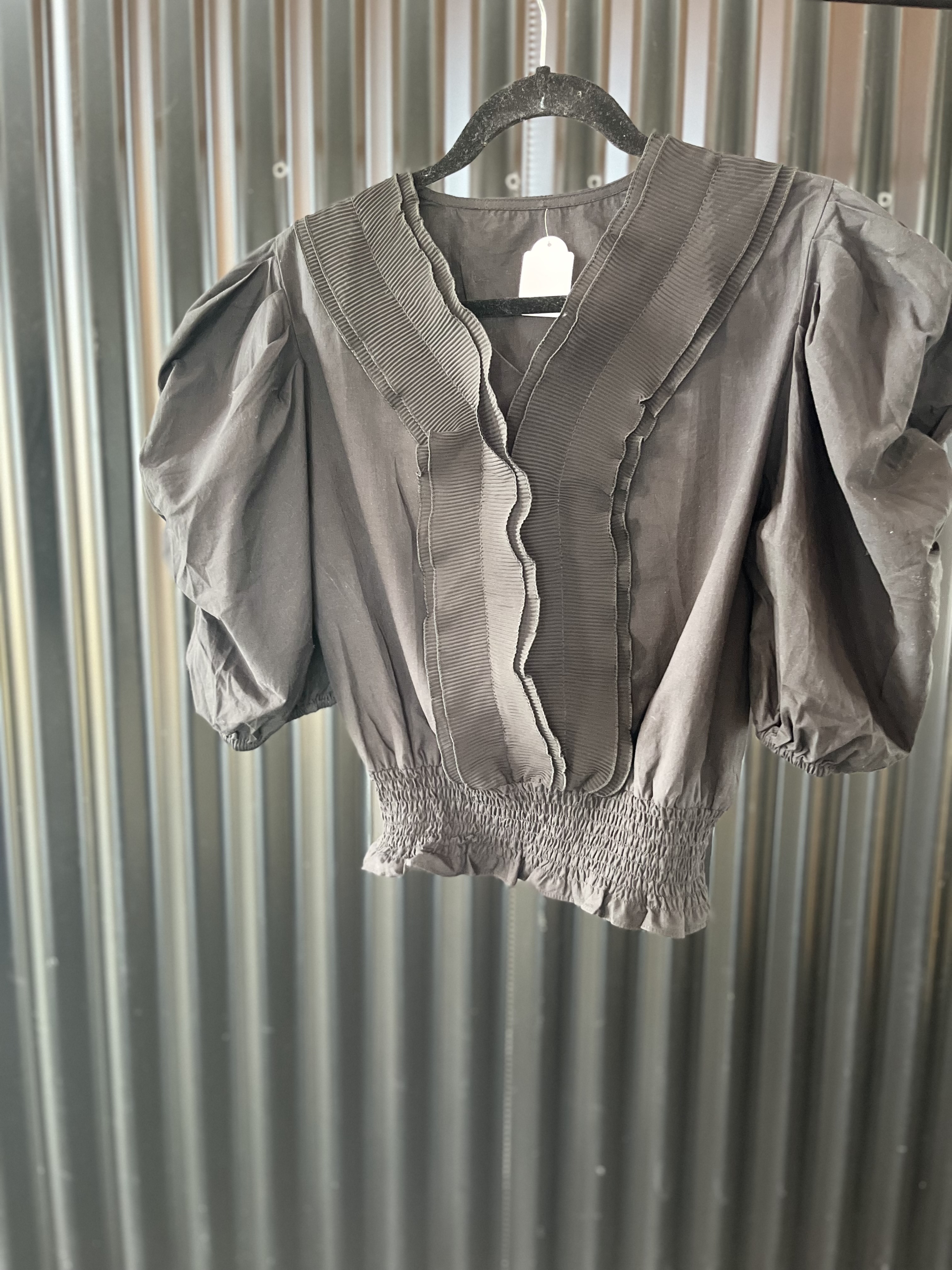 Blusa de manga abullonada