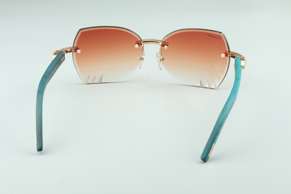 Diamond Teal Carti Woods Sunglasses (Orange Butterfly Lenses) 