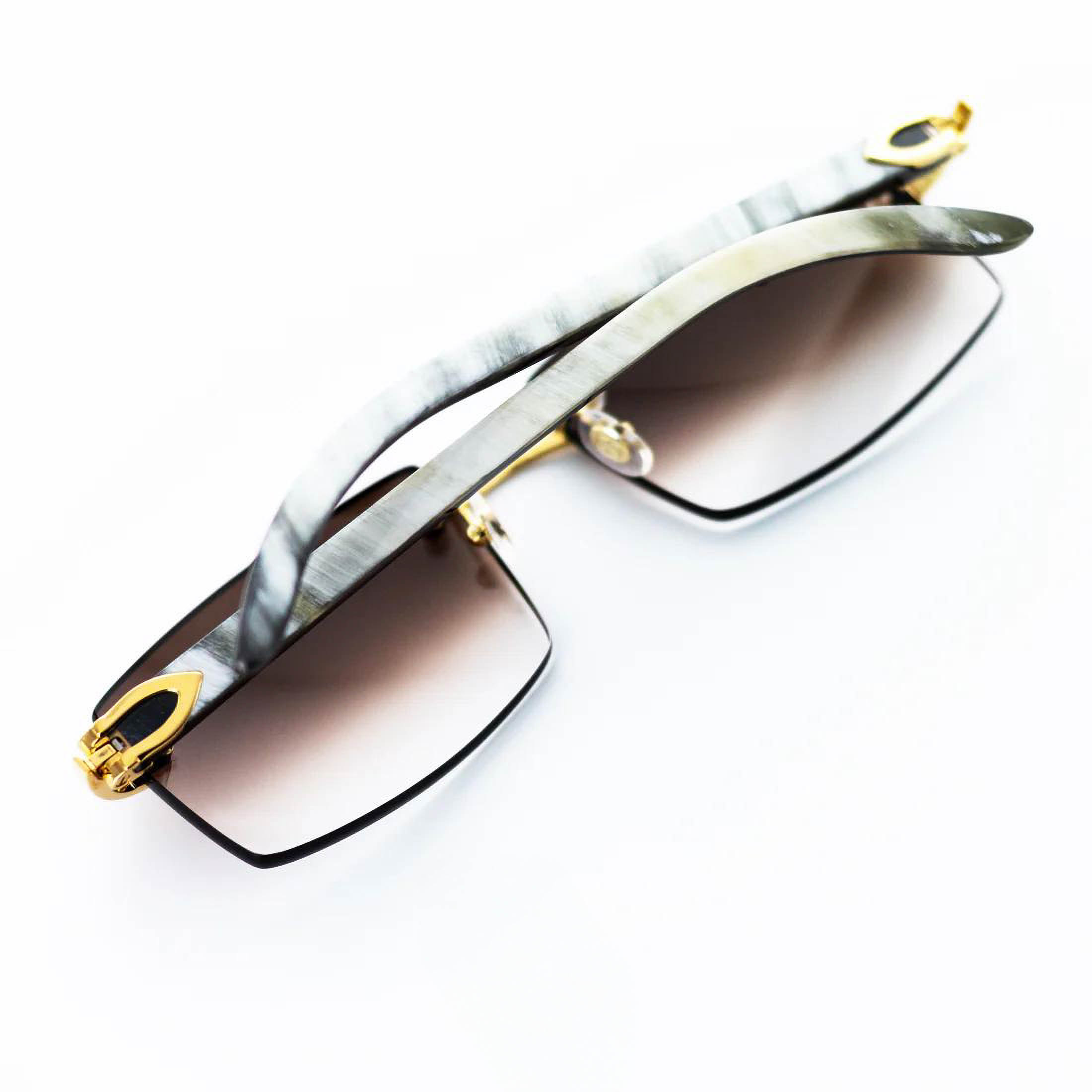 Authentic Cartier White Horn Sunglasses CT0046O-001 • Iconic White Buffs • Gold/Platinum Hardware Options • Gradient Brown or Diamond Cut Lenses • Luxury Eyewear • Genuine Cartier with Certificate
