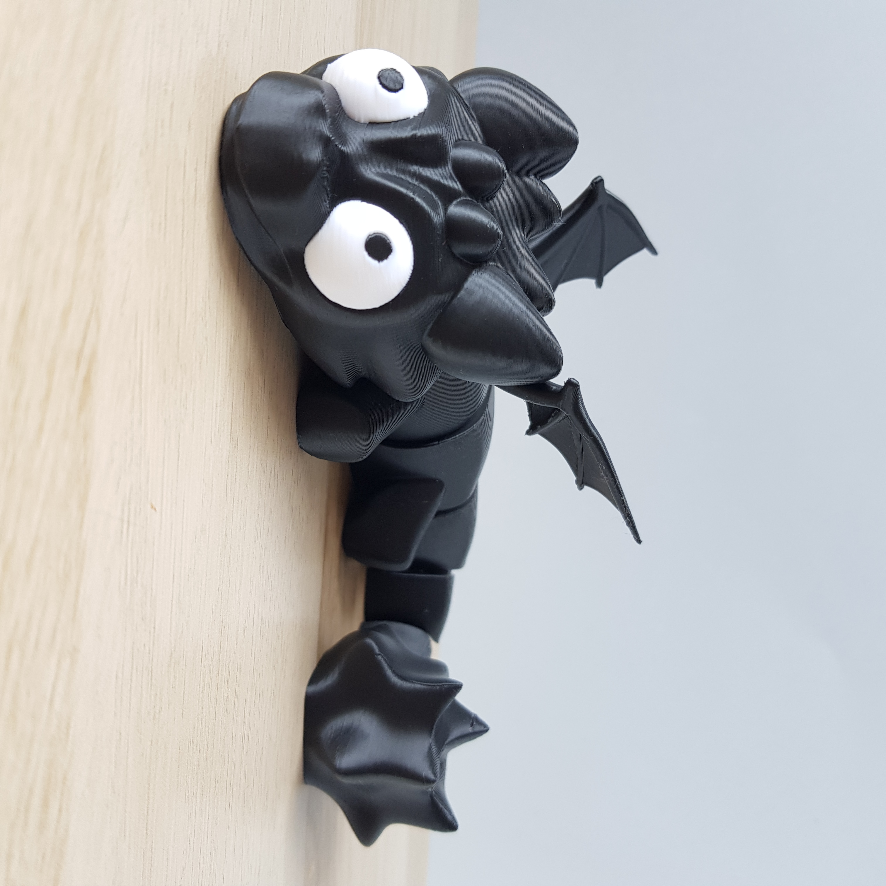 Dragão preto articulado anti-stress impresso em 3D 