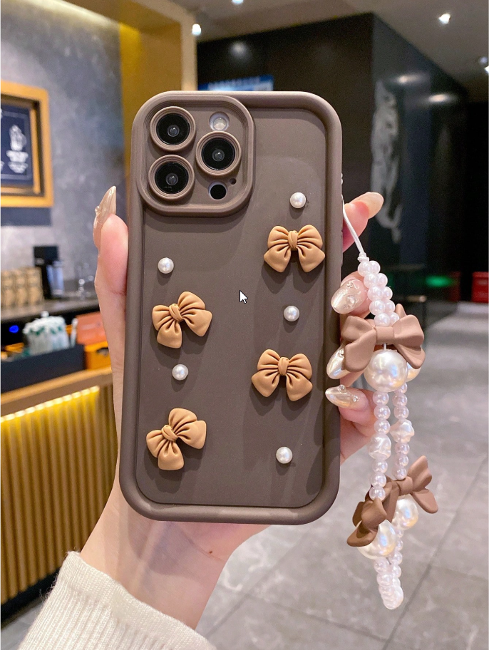 Coque de téléphone avec nœuds et perles
