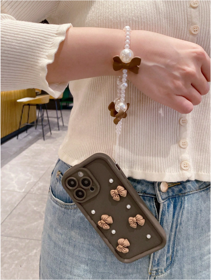 Coque de téléphone avec nœuds et perles
