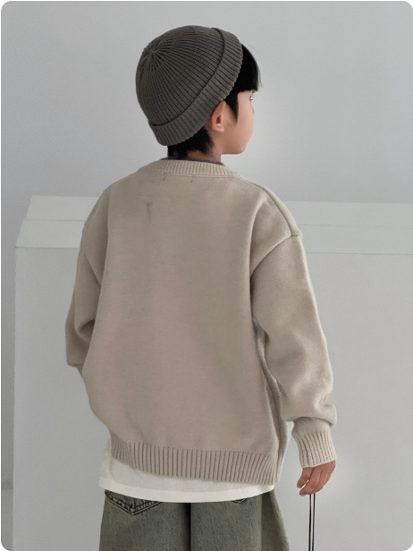 Pull en tricot beige pour enfant