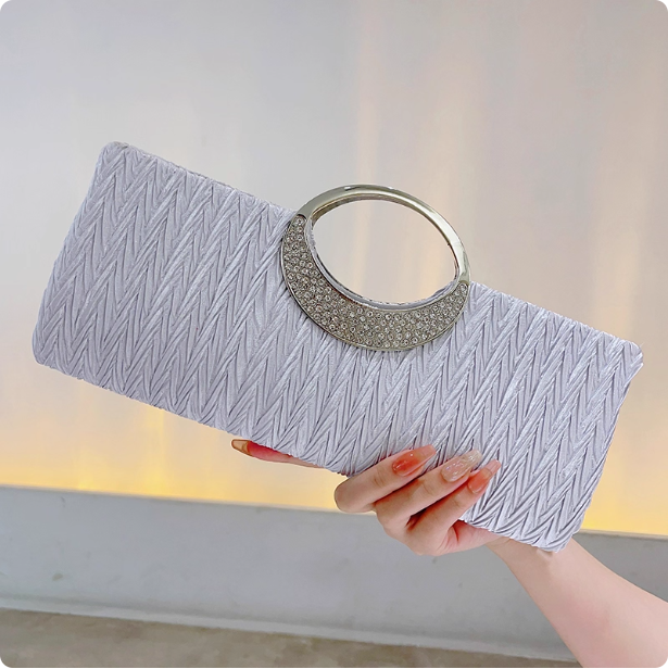Pochette élégante à poignée circulaire