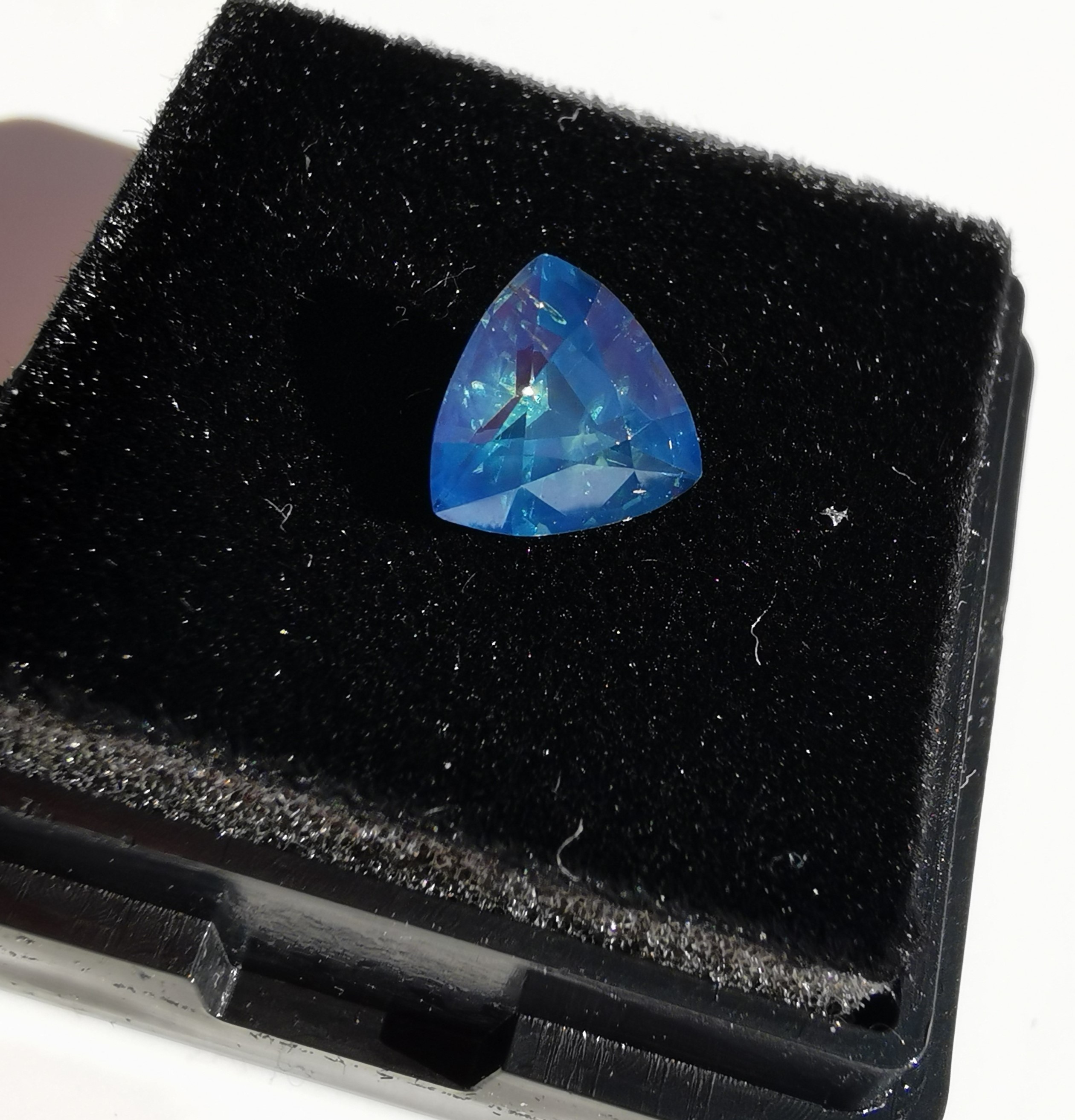 1.3 ct. trillion cut teal colored sapphire  