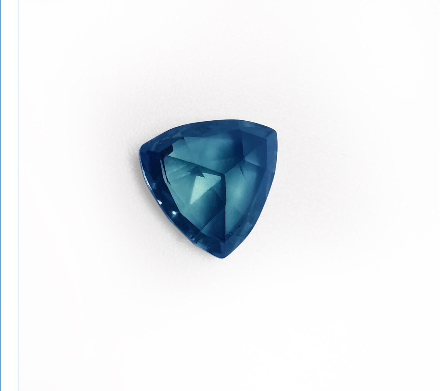 1.3 ct. trillion cut teal colored sapphire  