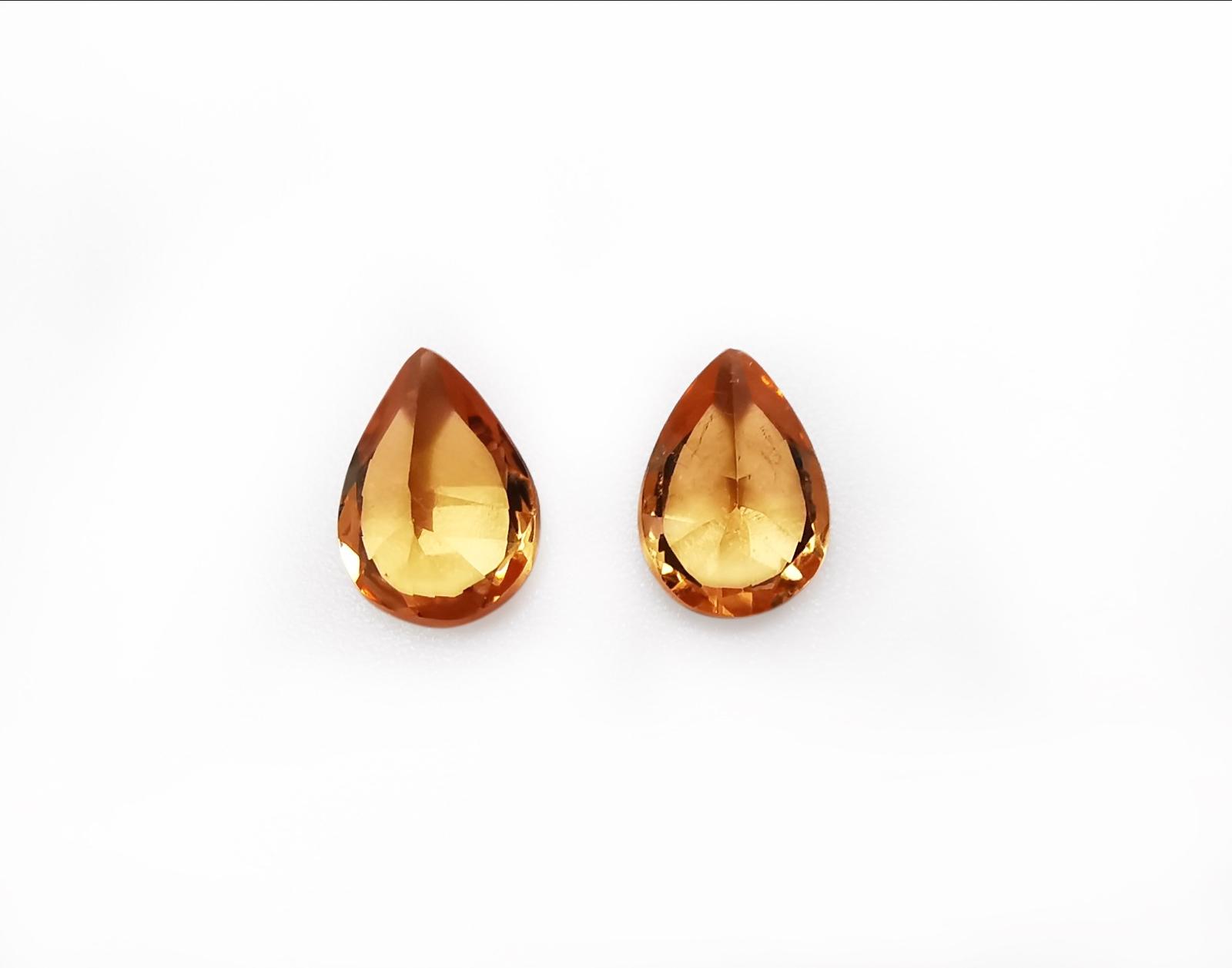 1.2 ct. pair of orange garnets (0.6 ct. each)