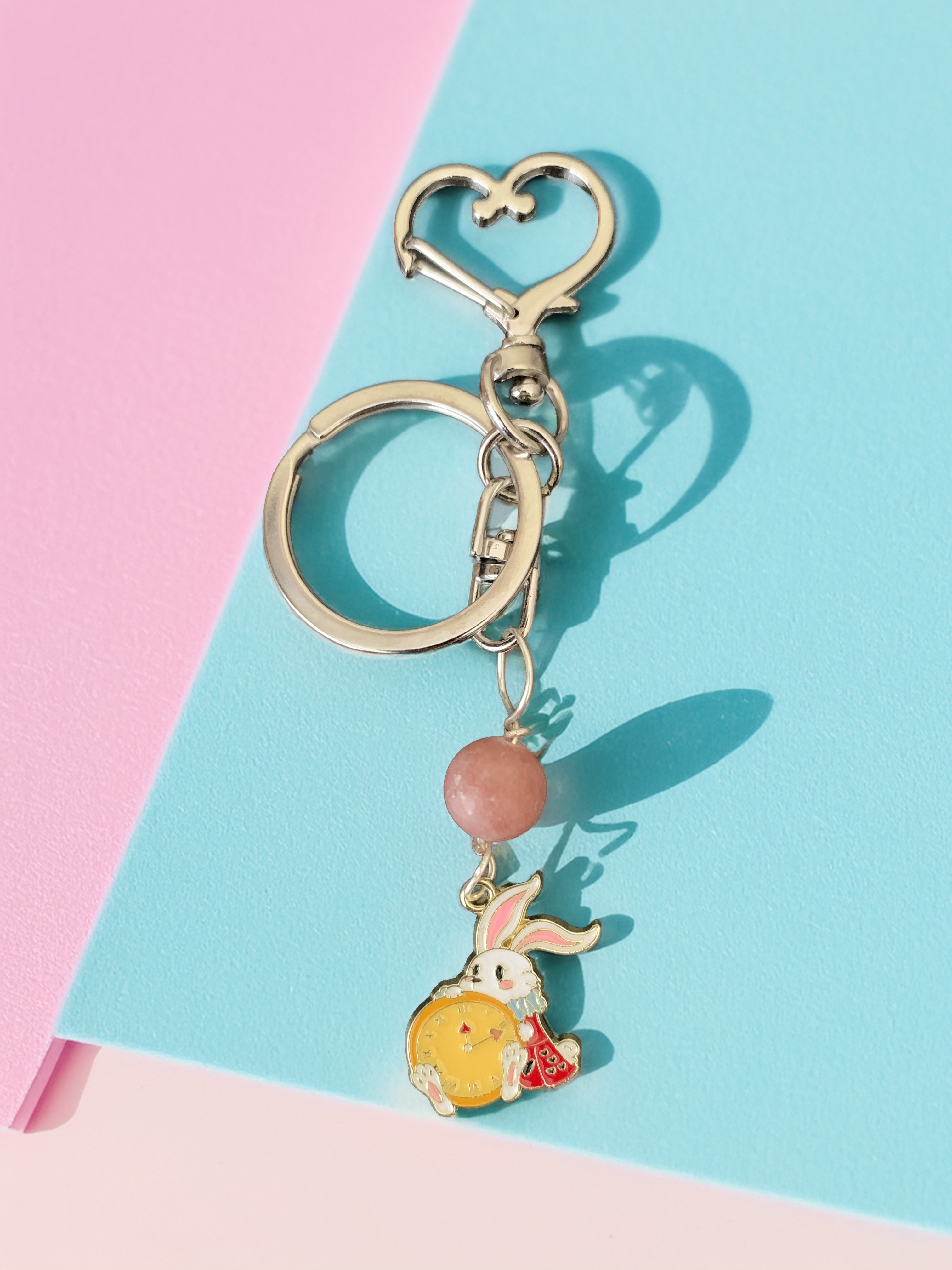 Rabbit holding a Clock Keychain