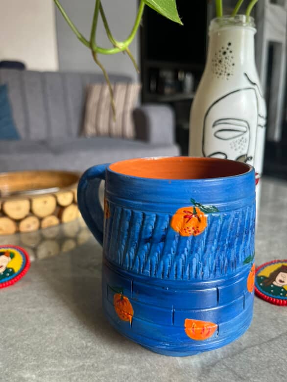 Hand-Painted Blue Terracotta Mug with Orange Motifs – ₹675