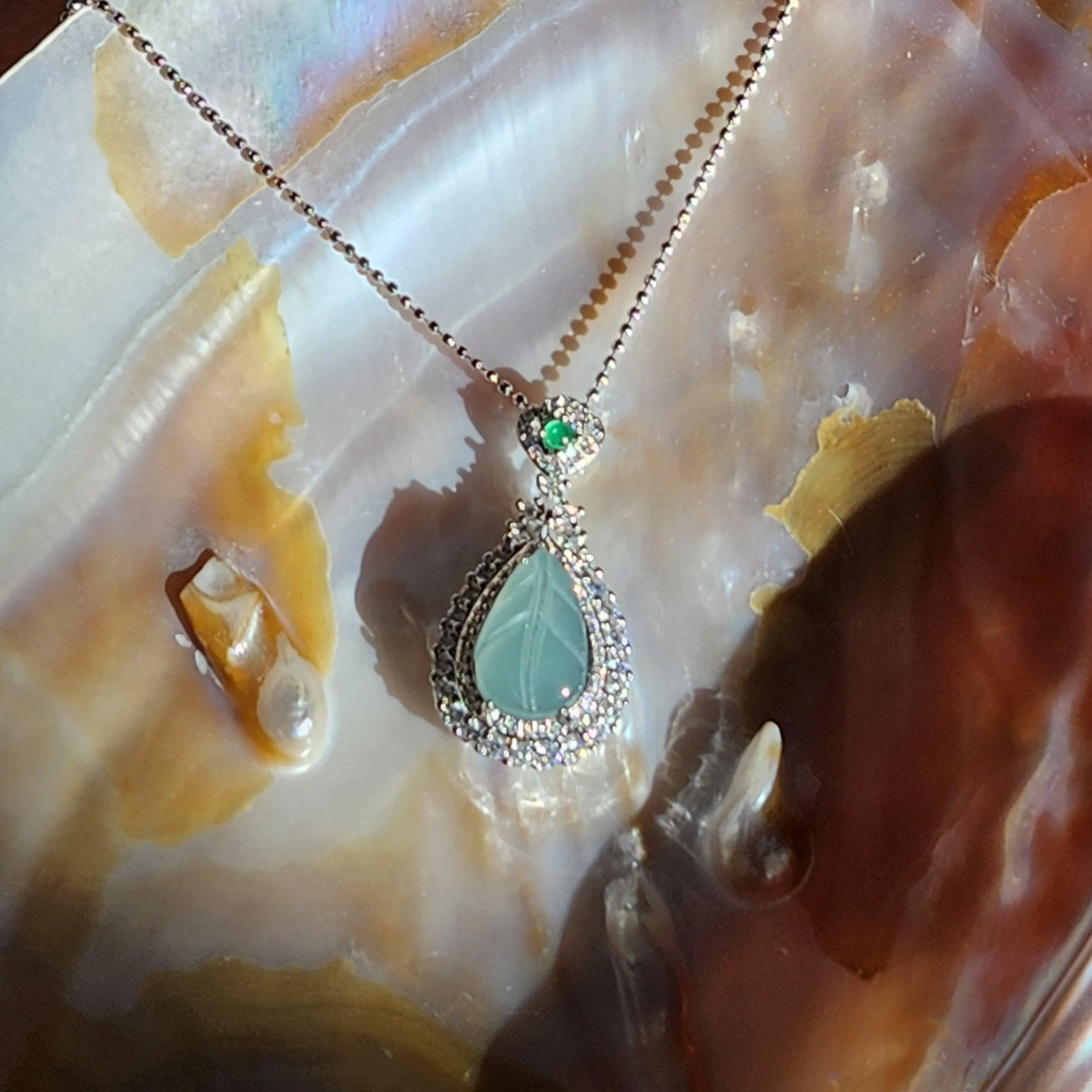 Blue icy translucent Jade leaf pendant set in silver  • Blue Burmese jade jewelry with cubic zirconia • 