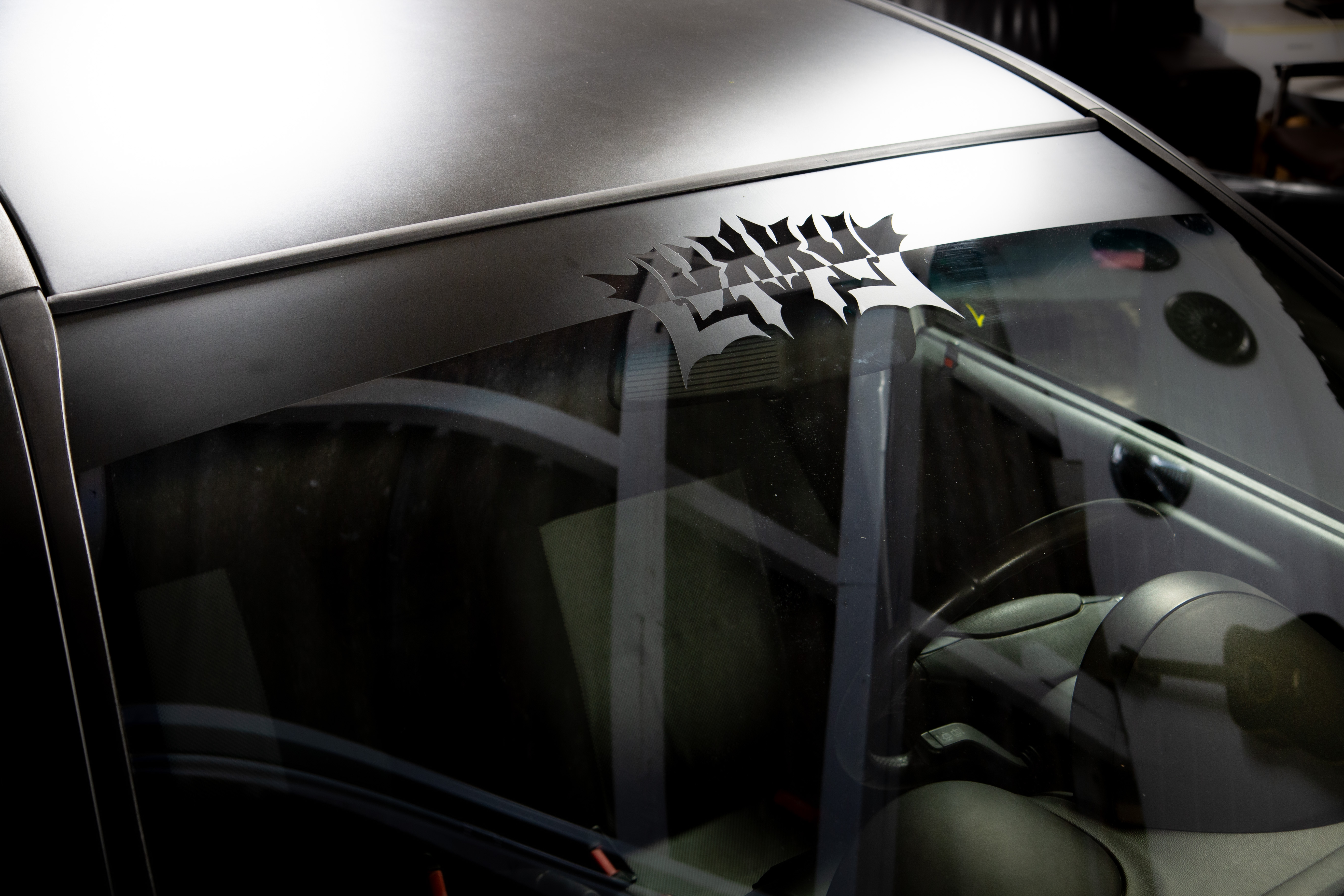 "LVXXVL" Cut-through sunstrip