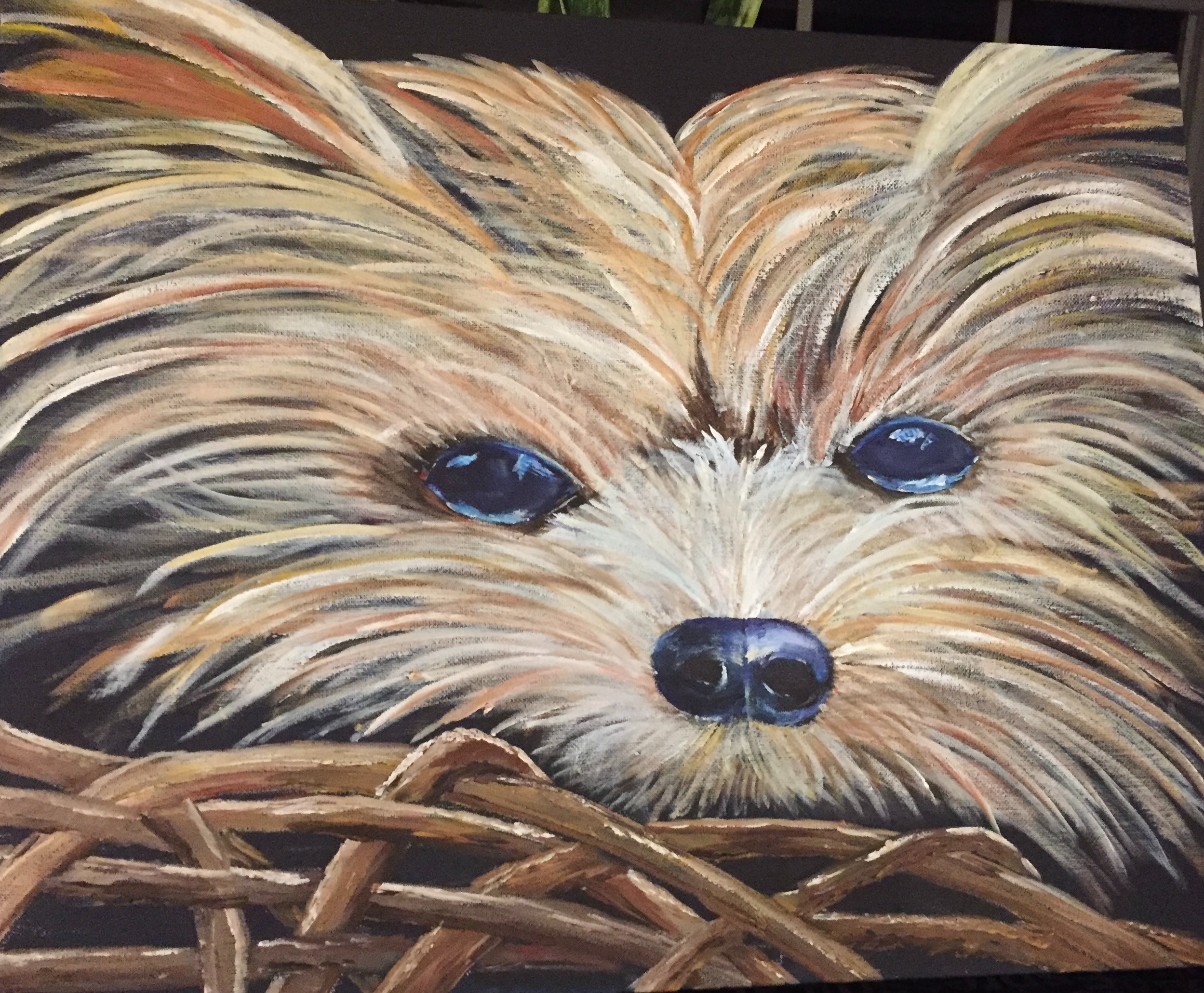 Painting of a dog with blue eyes in a basket