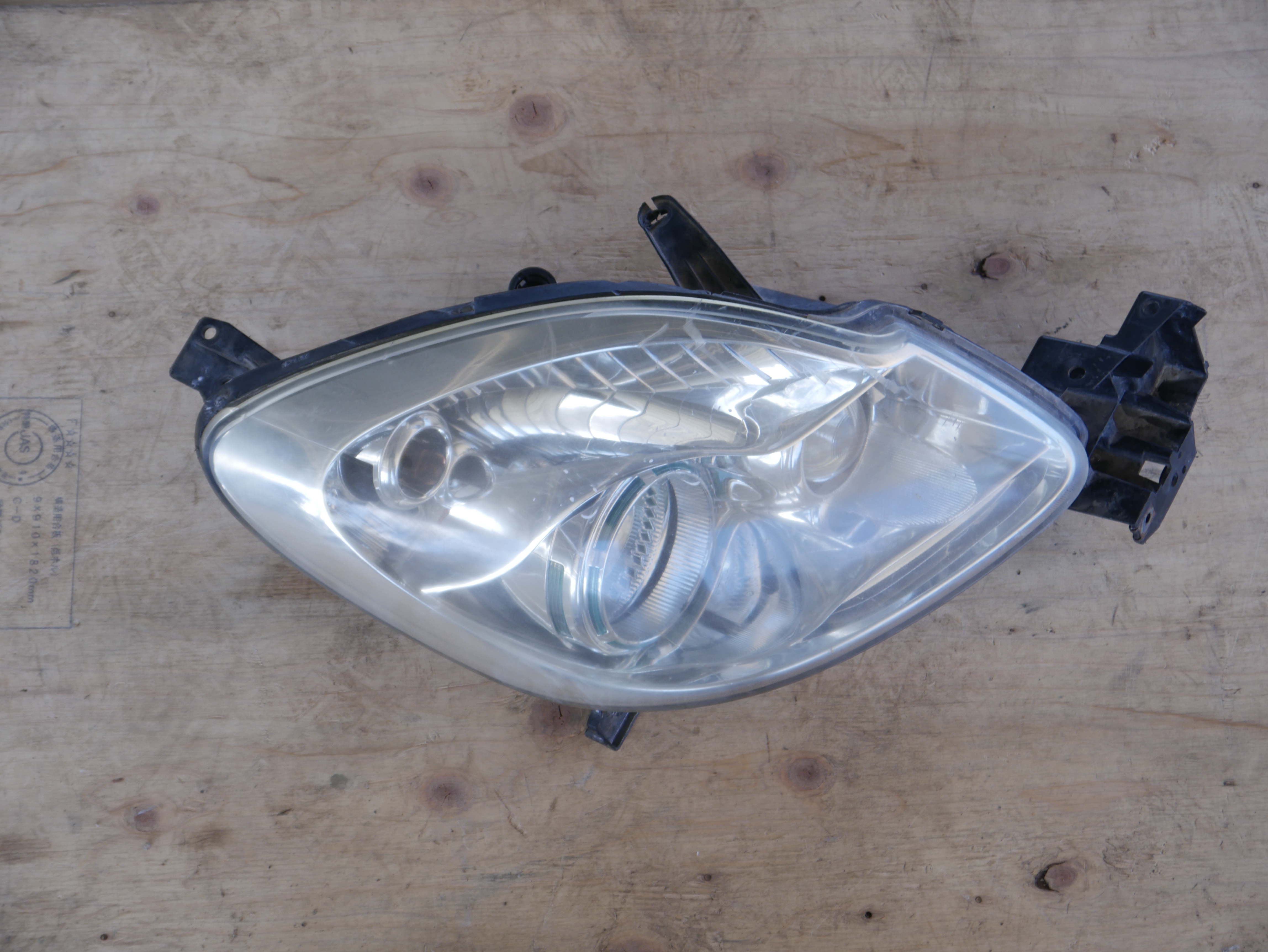 Mazda Verissa Headlight