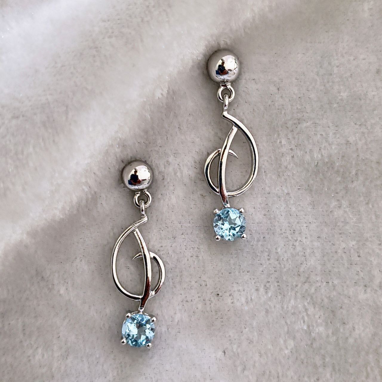 Elegant Silver Earrings With Blue Topaz