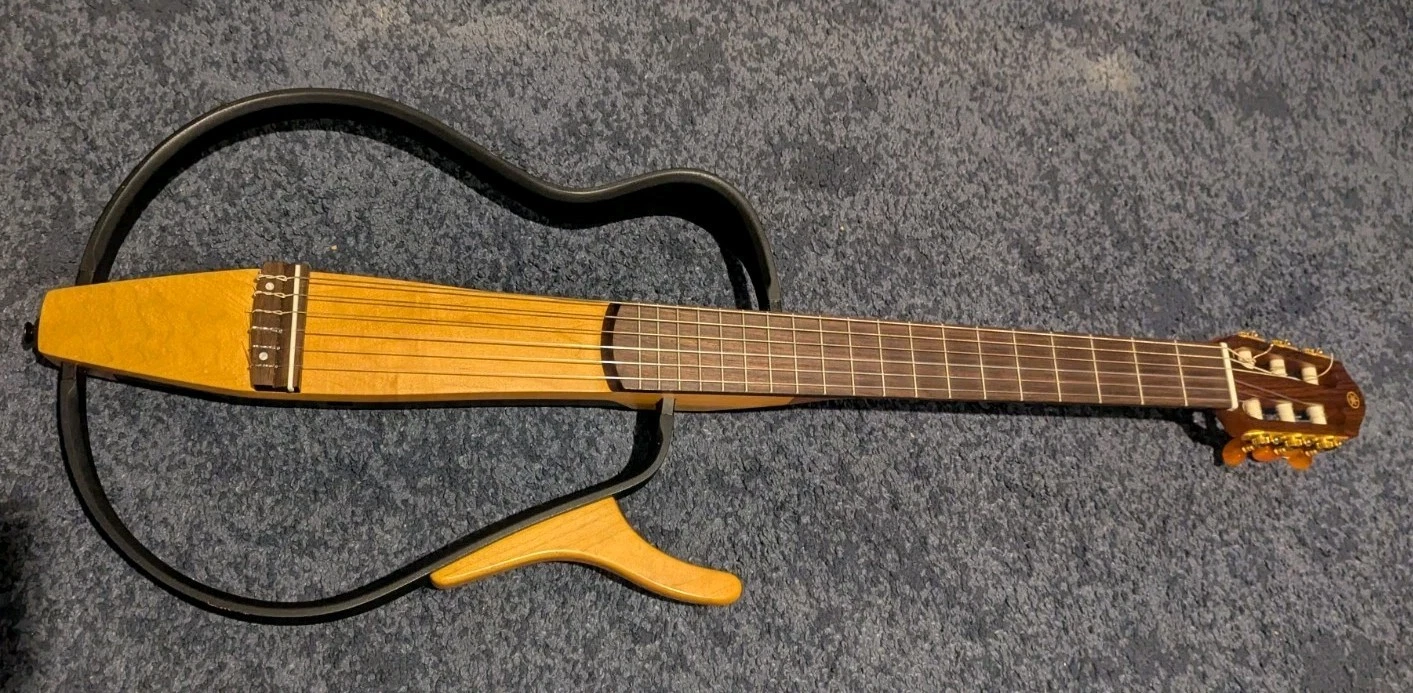 Yamaha SLG200N silent guitar nylon travel together with original gig bag.