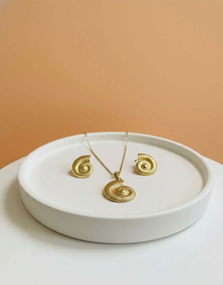Set de joyería en forma de caracol dorado