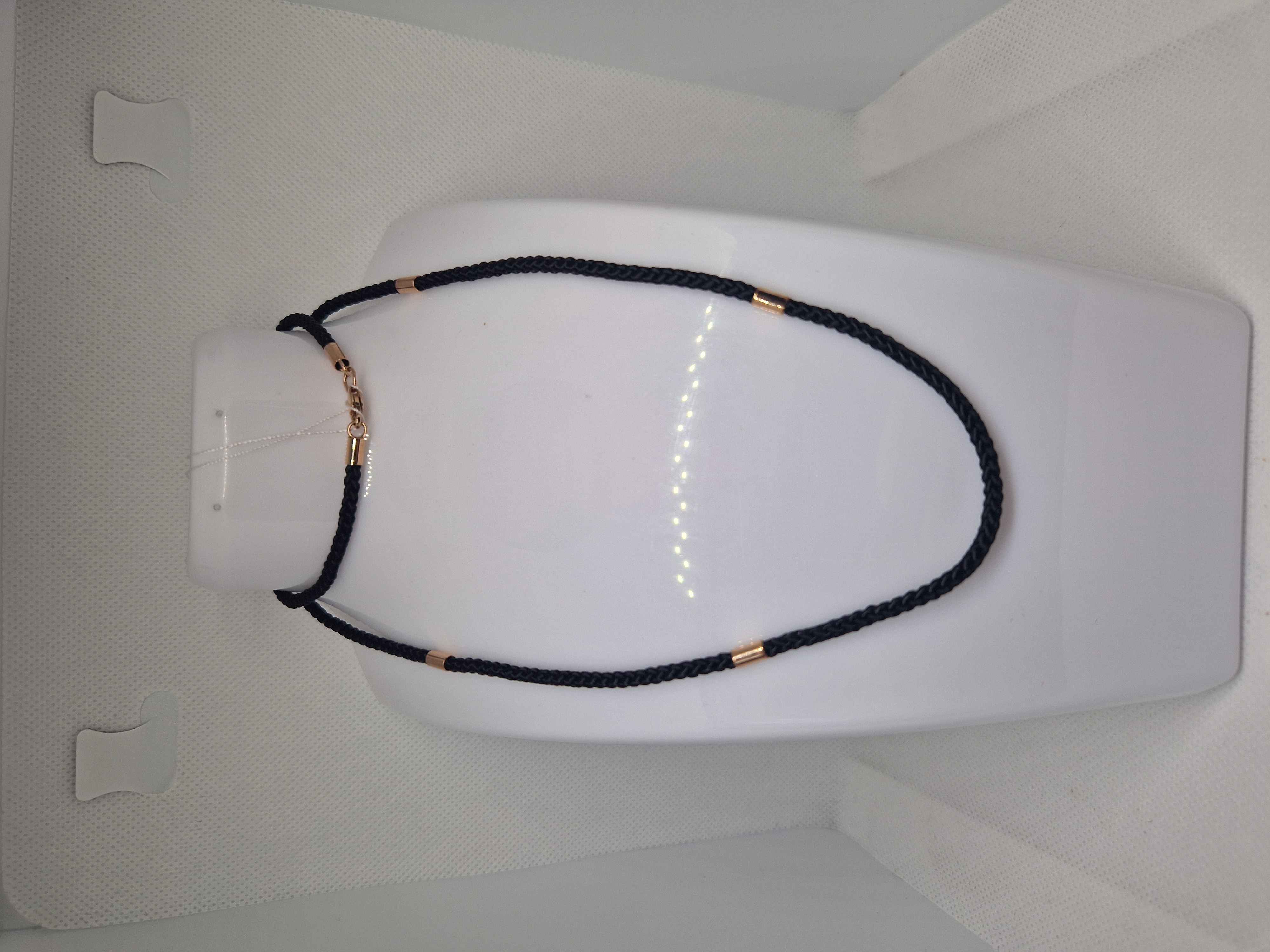 Black syntetic cord with gold insert and a lock