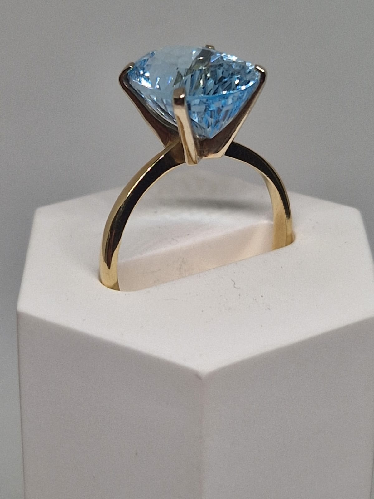 Golden Ring with a Blue Topaz inlay