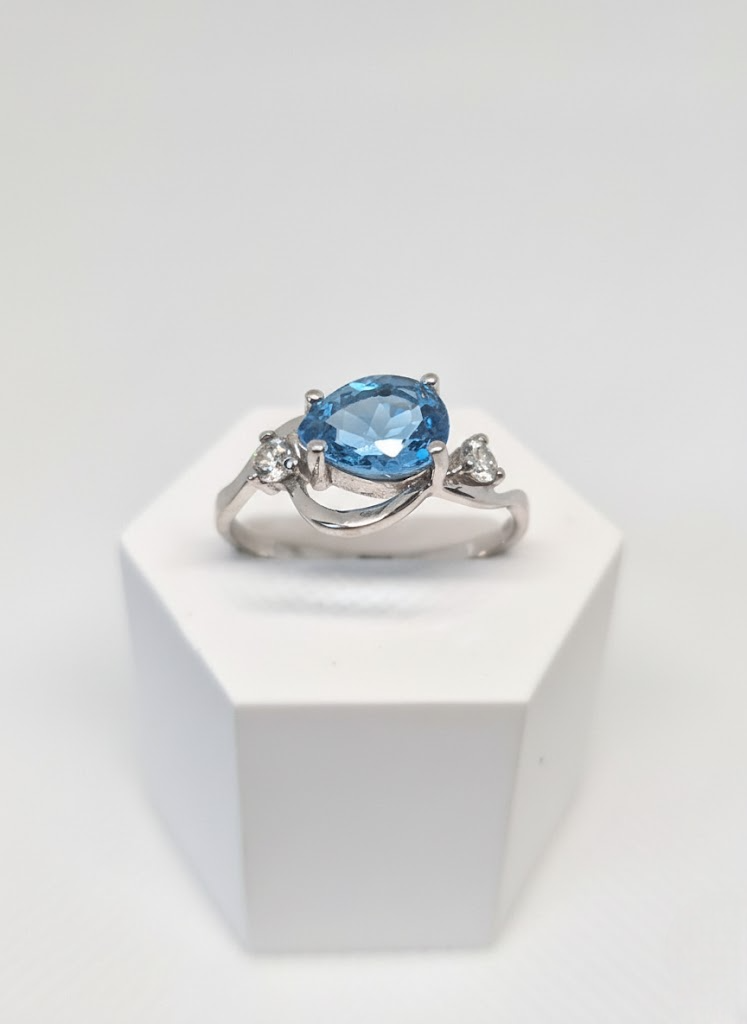 Silver Ring with a Topaz and Cubic Zirconia inlay