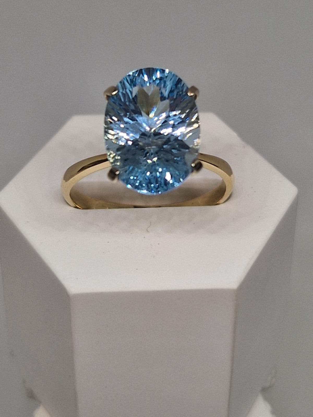 Golden Ring with a Blue Topaz inlay