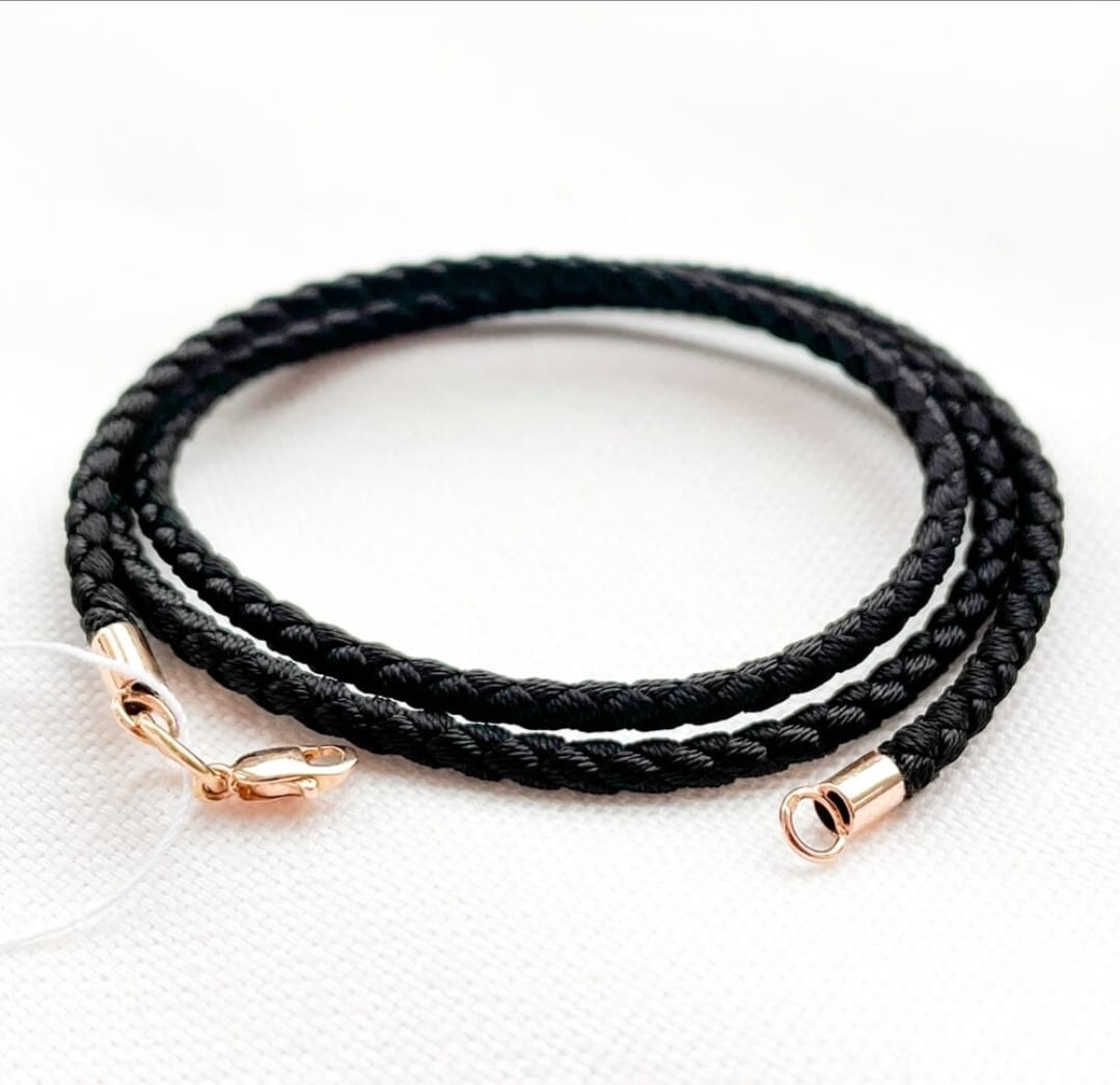 Black syntetic cord with gold ends and a lock