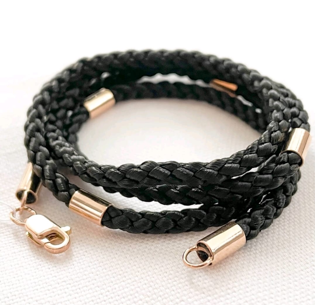 Black syntetic cord with gold insert and a lock