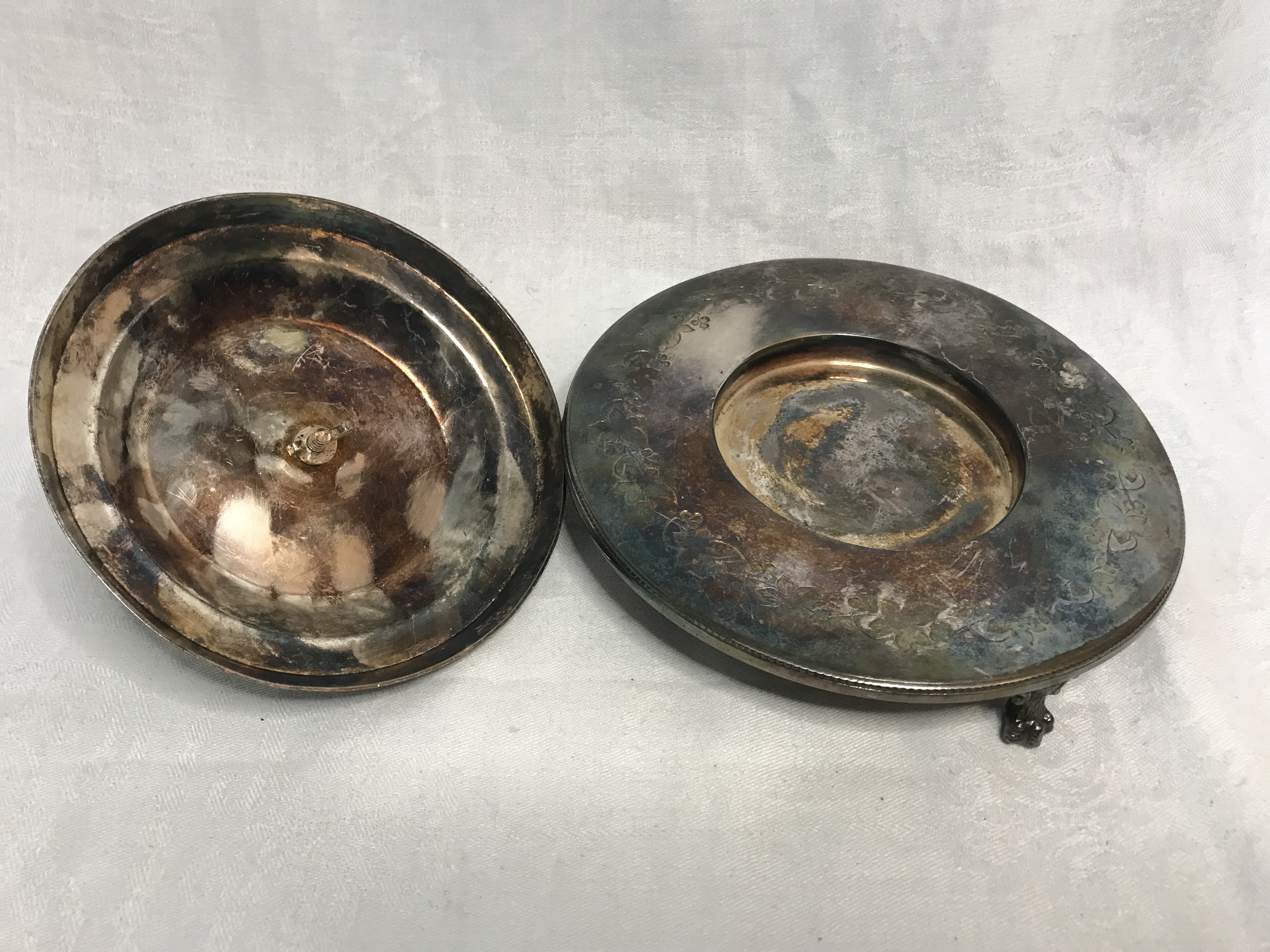 Silver plated covered serving dish on 3 claw foot legs. Stamped F Spiller London