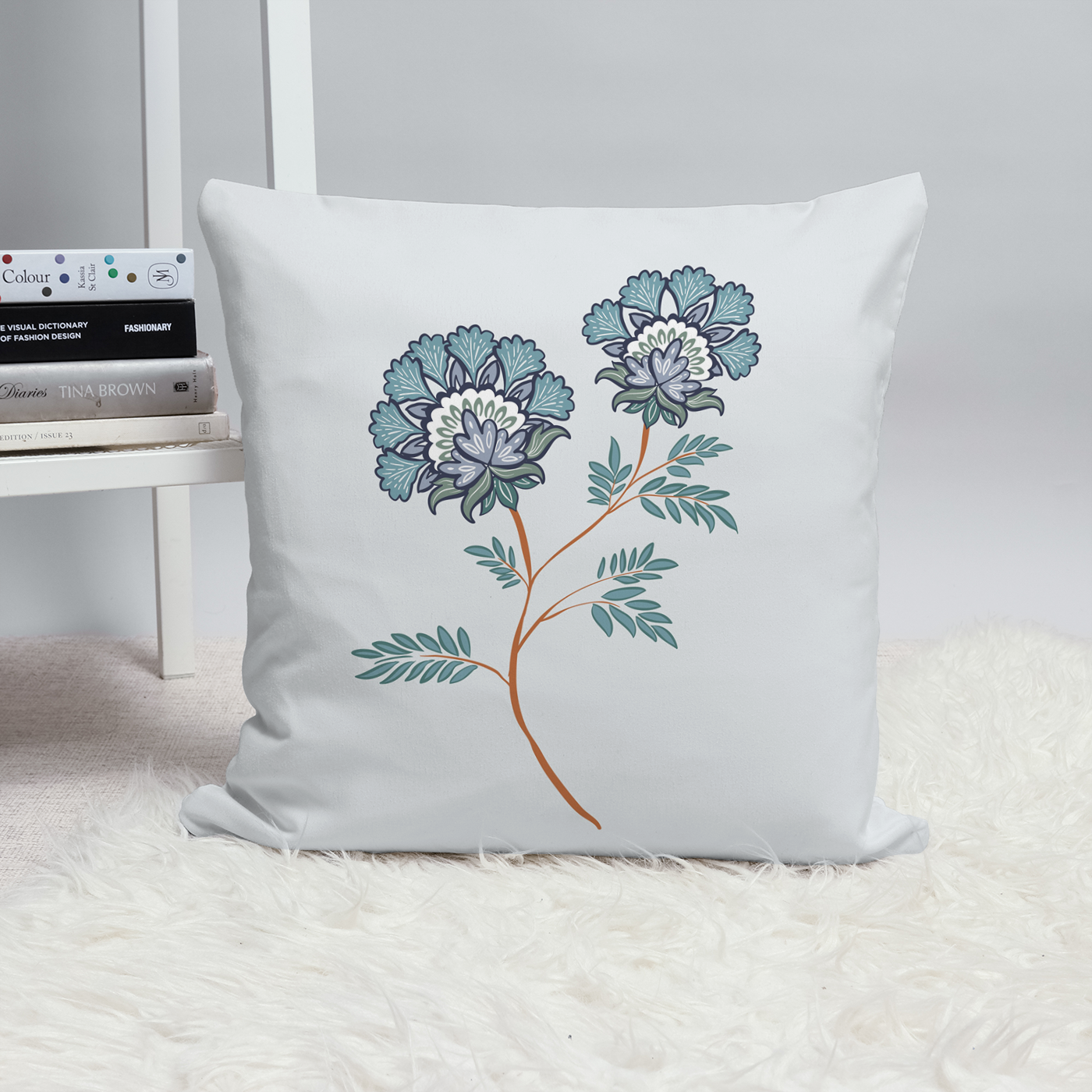 Floral Throw cushion. Light grey background.