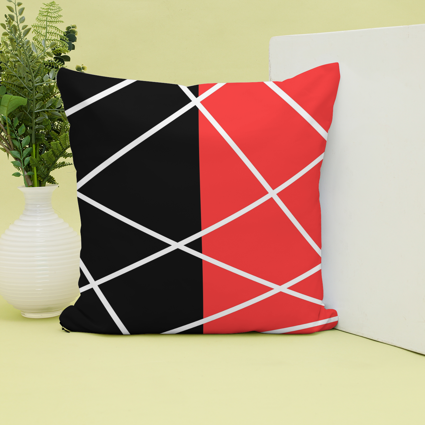Stunning cushion in a fresh red, black, and white lines design.