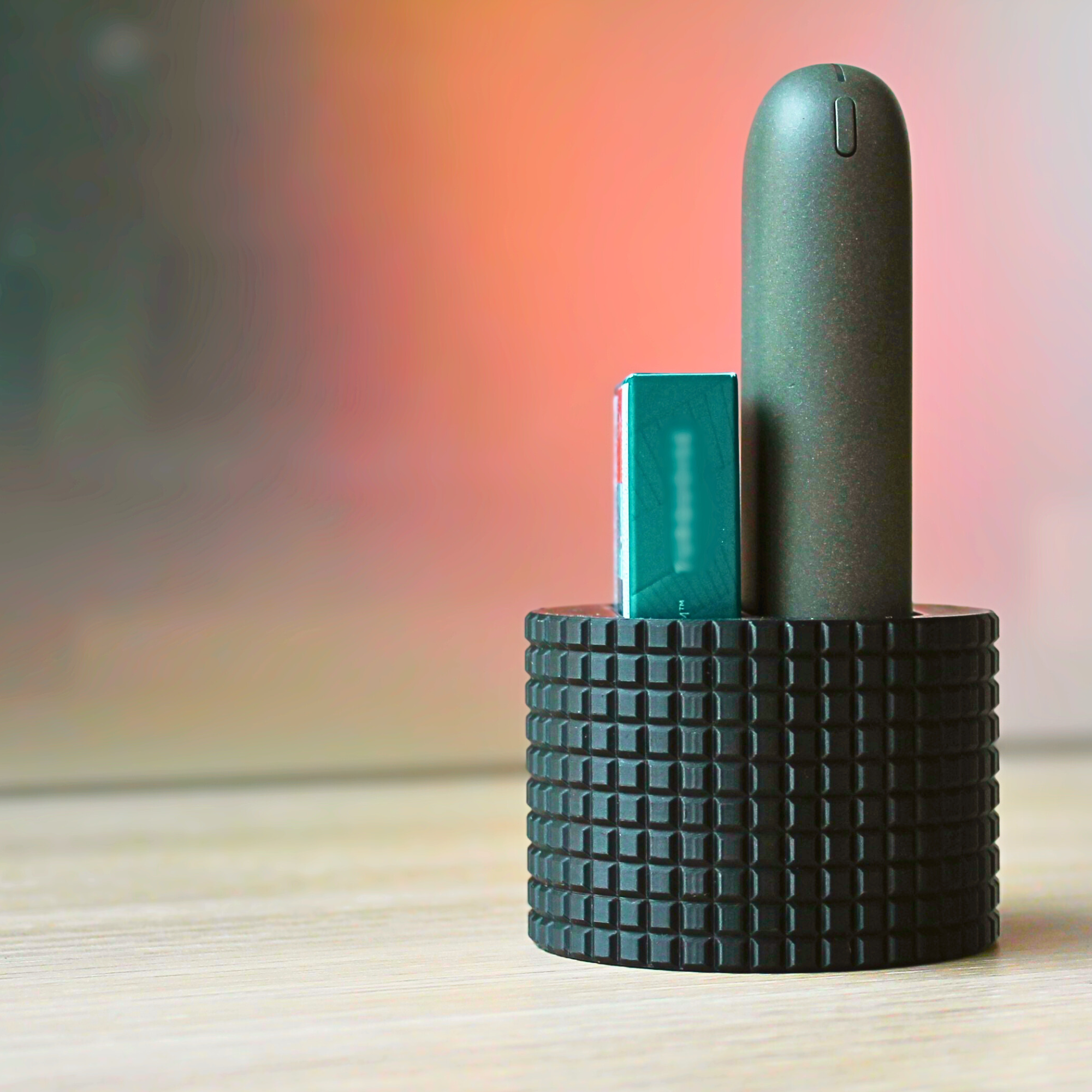 Desk stand for heat-not-burn devices and stick packs