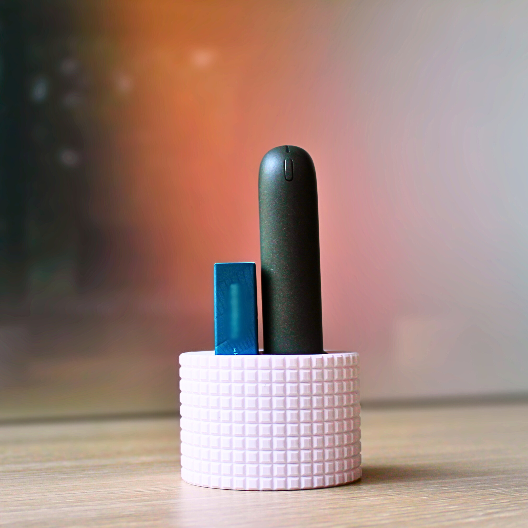 Desk stand for heat-not-burn devices and stick packs