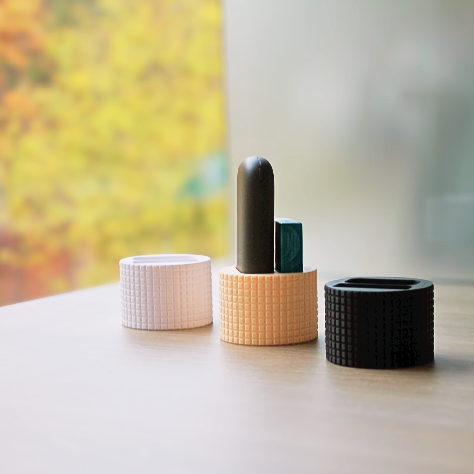 Desk stand for heat-not-burn devices and stick packs