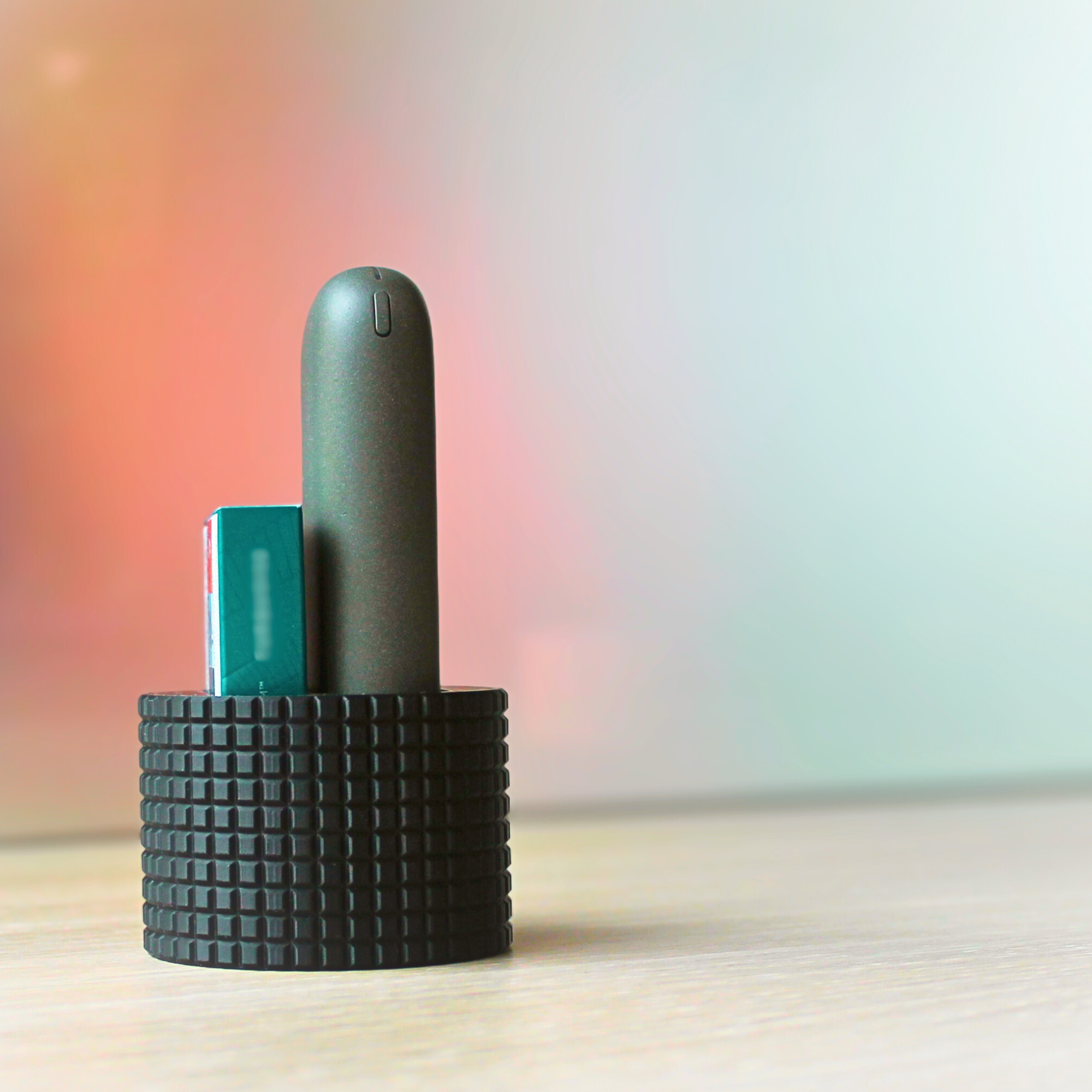 Desk stand for heat-not-burn devices and stick packs