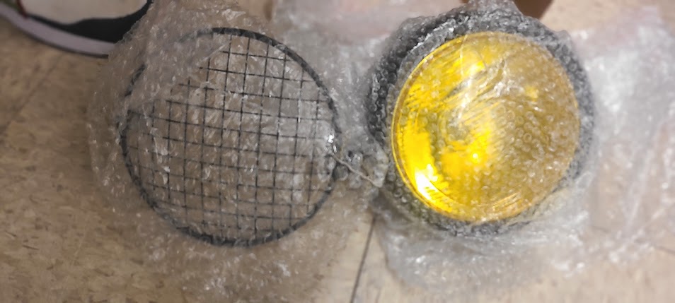 Yellow Motorcycle Headlight with Protective Covers
