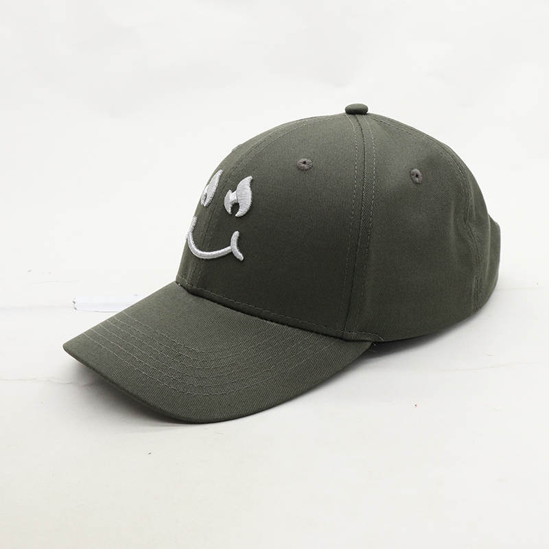 Grey Cap Silver Smiley Face logo