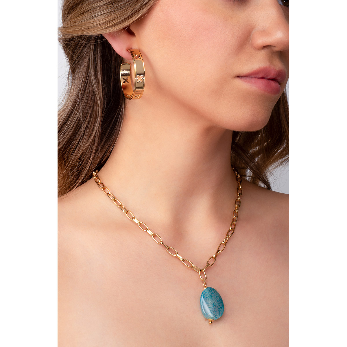 Aretes en baño de oro 18k diseño de cruces